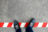 Black,Casual,Shoes,Standing,On,Red,And,White,Line.,Crossing